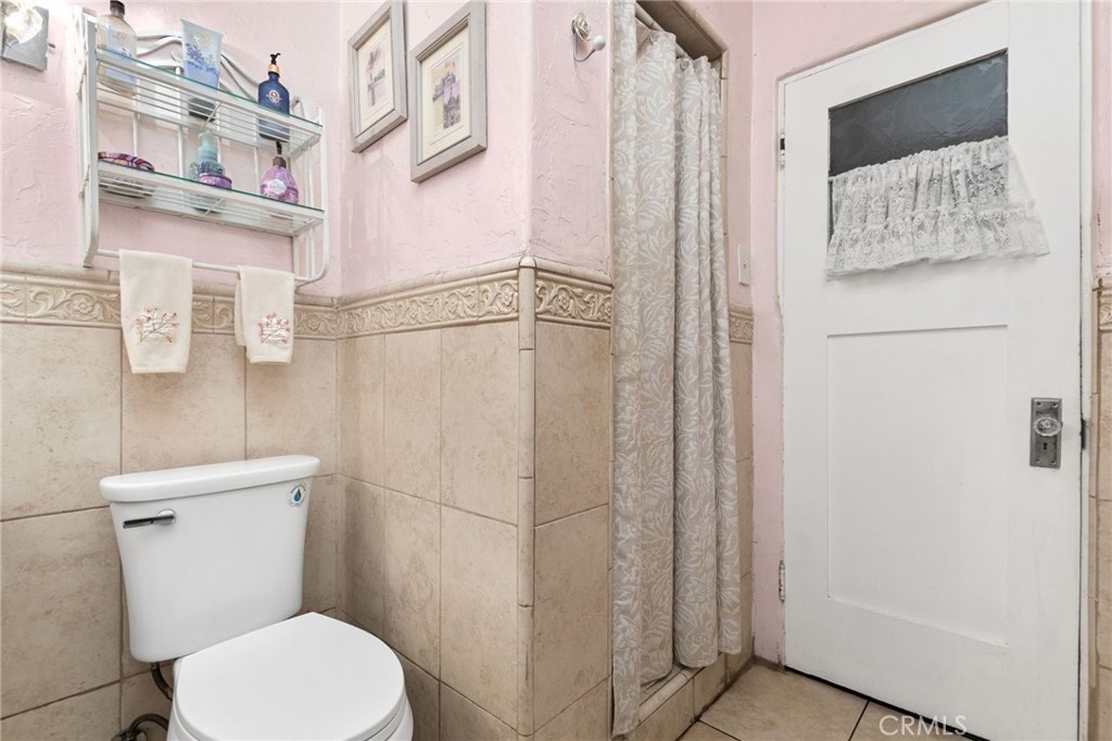 4202 University Riverside, CA 92501 - Photo 40 of 53 a white toilet sitting next to a bathroom sink