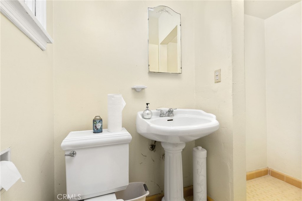 4202 University Riverside, CA 92501 - Photo 42 of 53 a bathroom with a sink a mirror and vanity