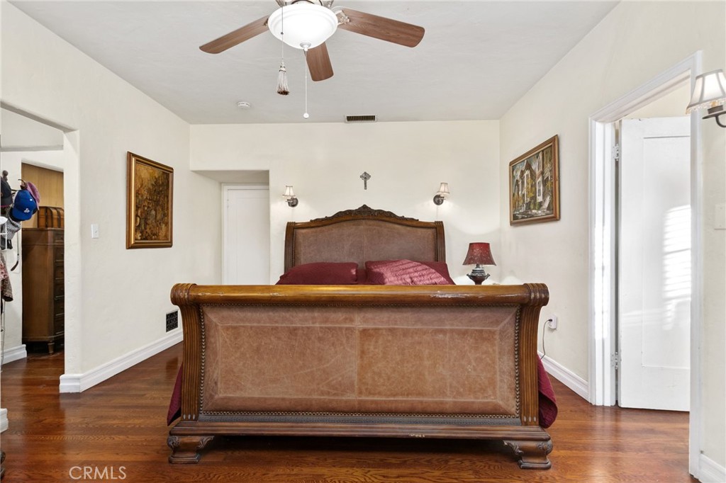 4202 University Riverside, CA 92501 - Photo 46 of 53 a bedroom with a bed and wooden floor