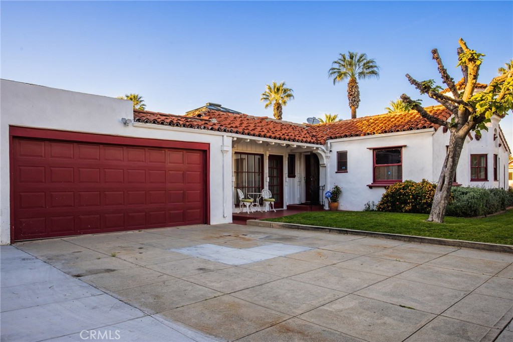 4202 University Riverside, CA 92501 - Photo 9 of 53 a front view of a house with a yard and garage