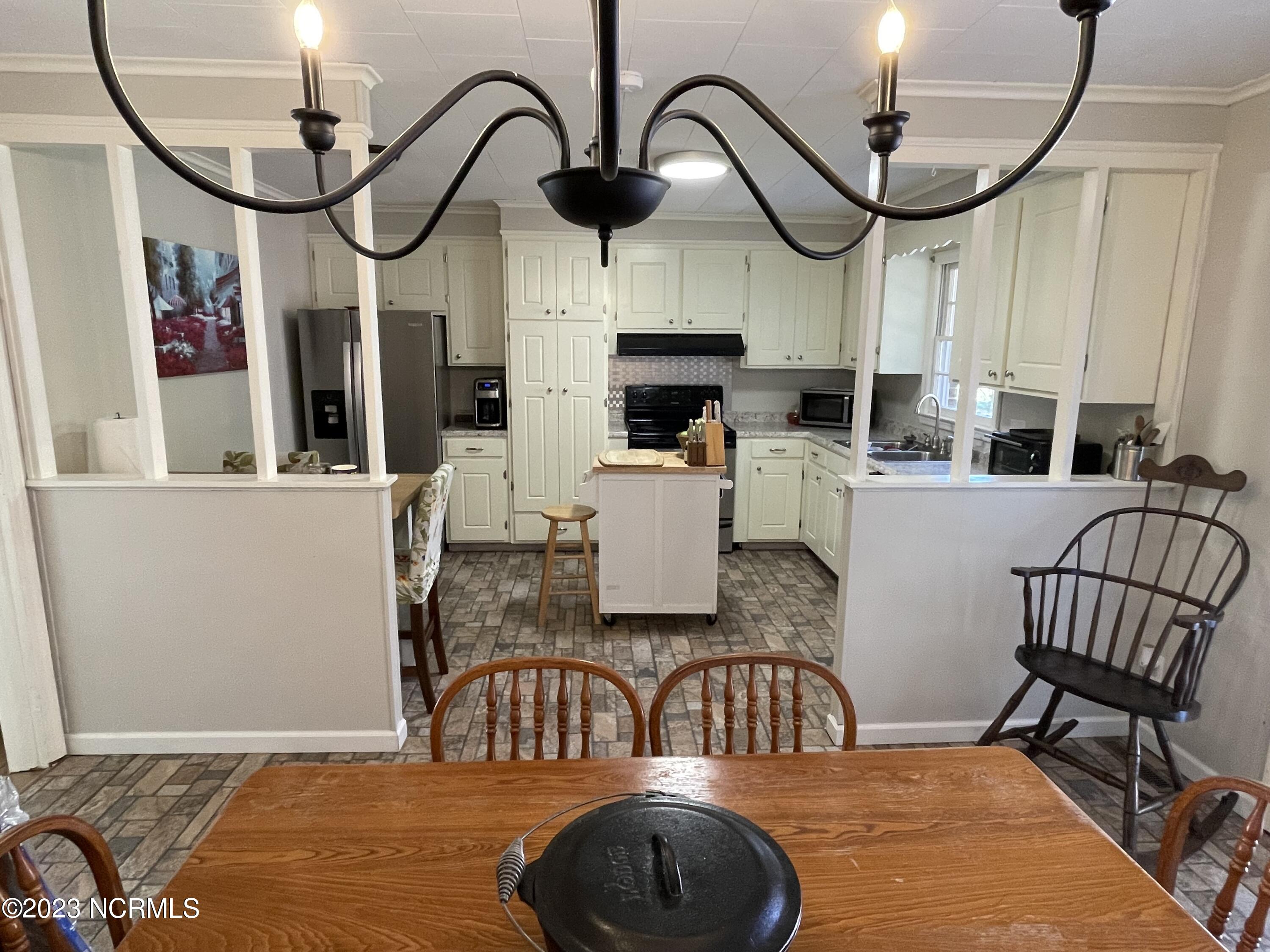 792 Roberts Road Newport, NC 28570 - Photo 11 of 52 Dining looking into kitchen with stainless steel appilances