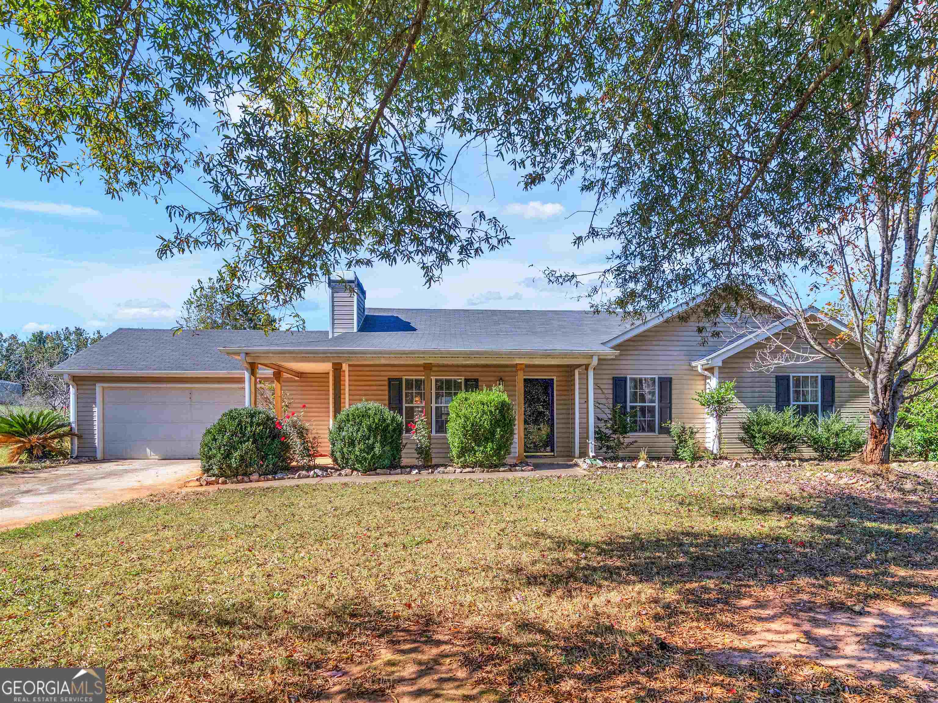 front view of a house with a yard