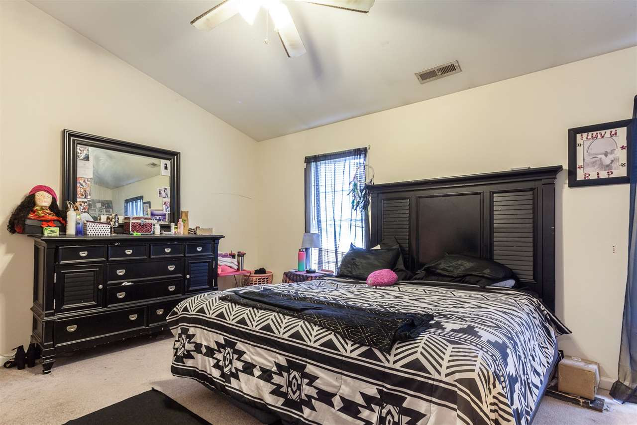 4000 Volkswalk Place Raleigh, NC 27610 - Photo 12 of 21 a bedroom with a bed and a mirror on dresser