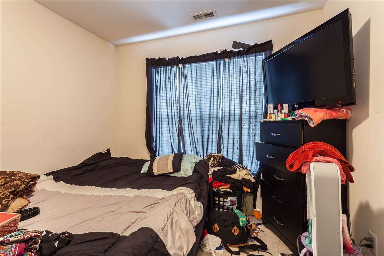 4000 Volkswalk Place Raleigh, NC 27610 - Photo 15 of 21 a bedroom with a bed and a television