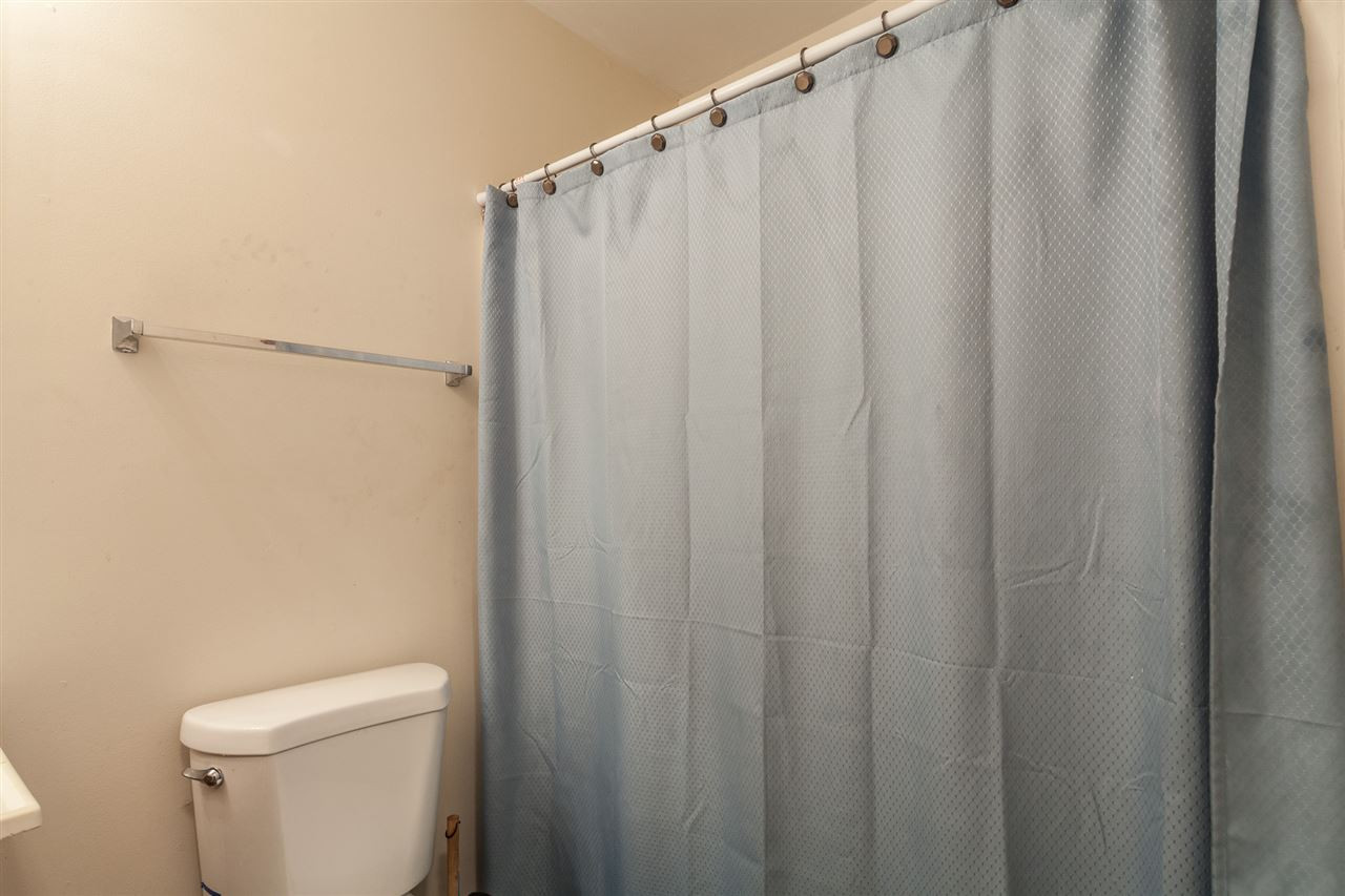4000 Volkswalk Place Raleigh, NC 27610 - Photo 17 of 21 a white toilet sitting next to a shower curtain
