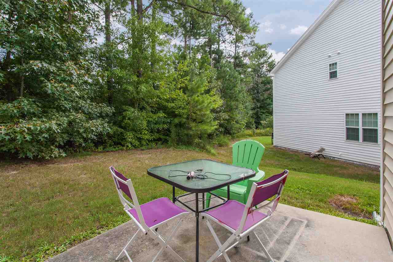 4000 Volkswalk Place Raleigh, NC 27610 - Photo 19 of 21 a view of a chairs and table in backyard of the house