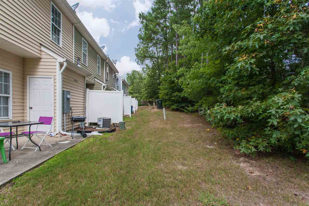 4000 Volkswalk Place Raleigh, NC 27610 - Photo 21 of 21 a backyard of a house with table and chairs