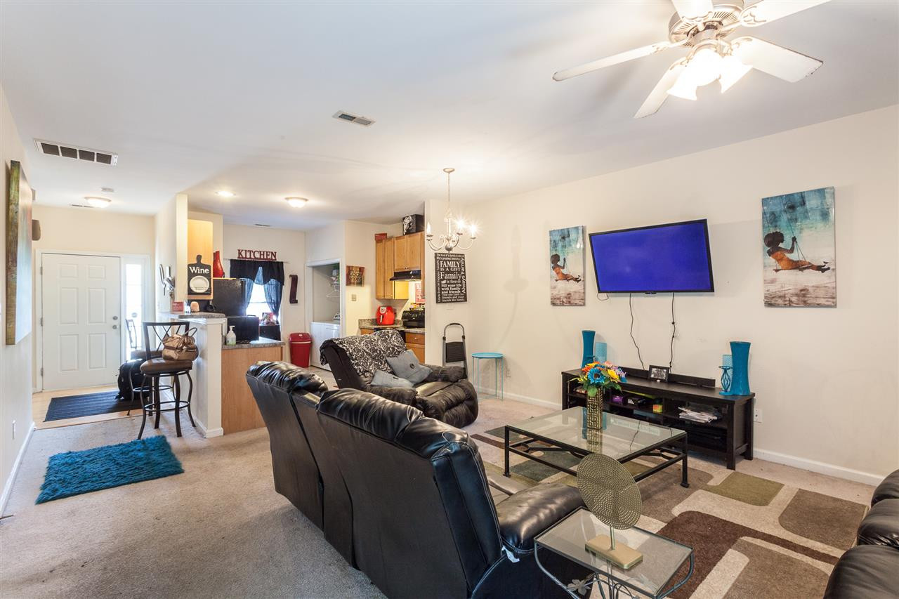 4000 Volkswalk Place Raleigh, NC 27610 - Photo 6 of 21 a living room with furniture and a flat screen tv