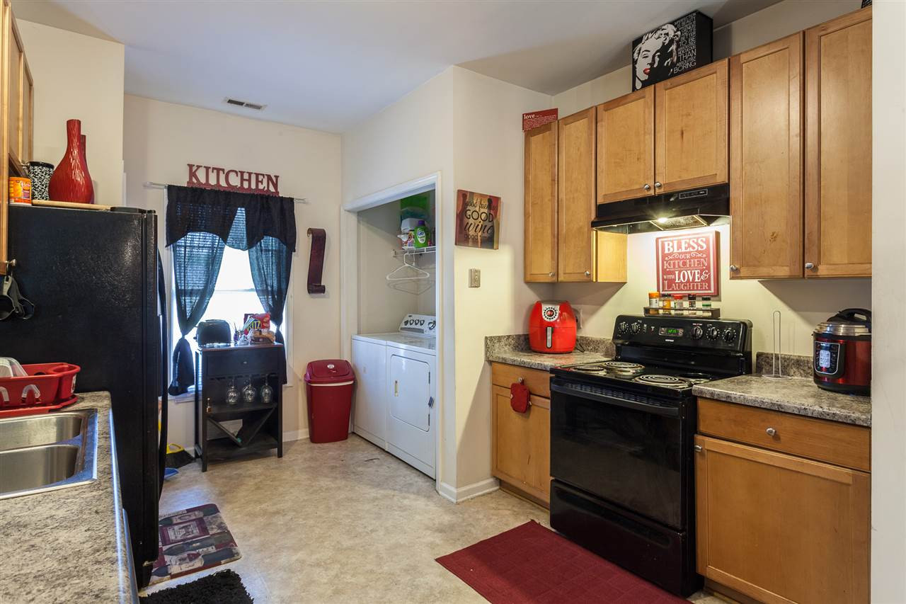 4000 Volkswalk Place Raleigh, NC 27610 - Photo 7 of 21 a kitchen with a refrigerator stove and a sink