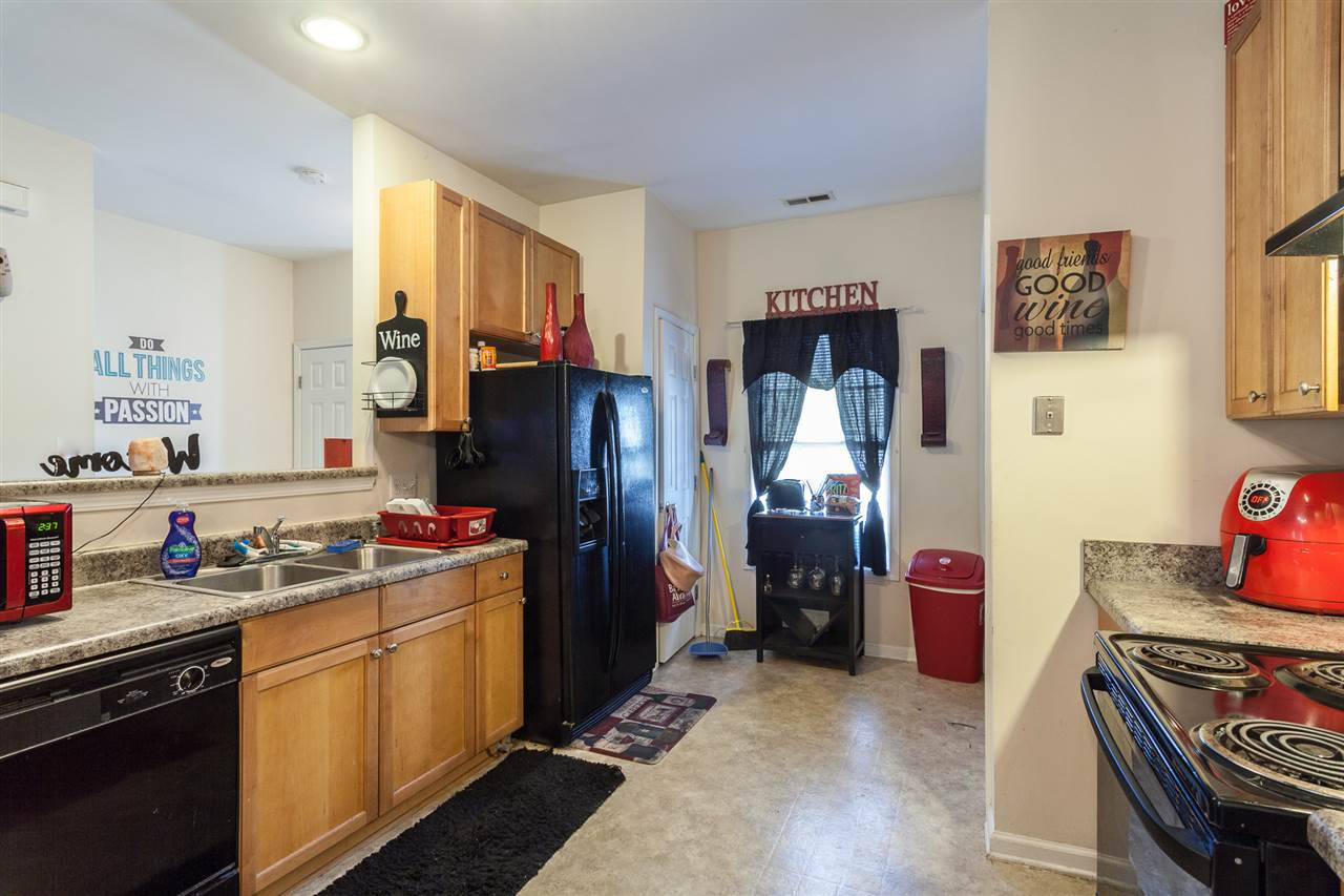 4000 Volkswalk Place Raleigh, NC 27610 - Photo 8 of 21 a kitchen with stainless steel appliances a stove refrigerator sink and cabinets