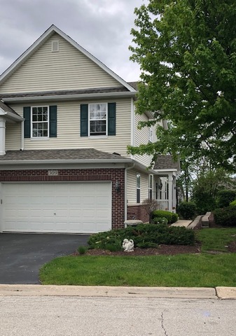 309 Ridge Road North Aurora, IL 60542 - Photo 1 of 16 a front view of a house with a garden