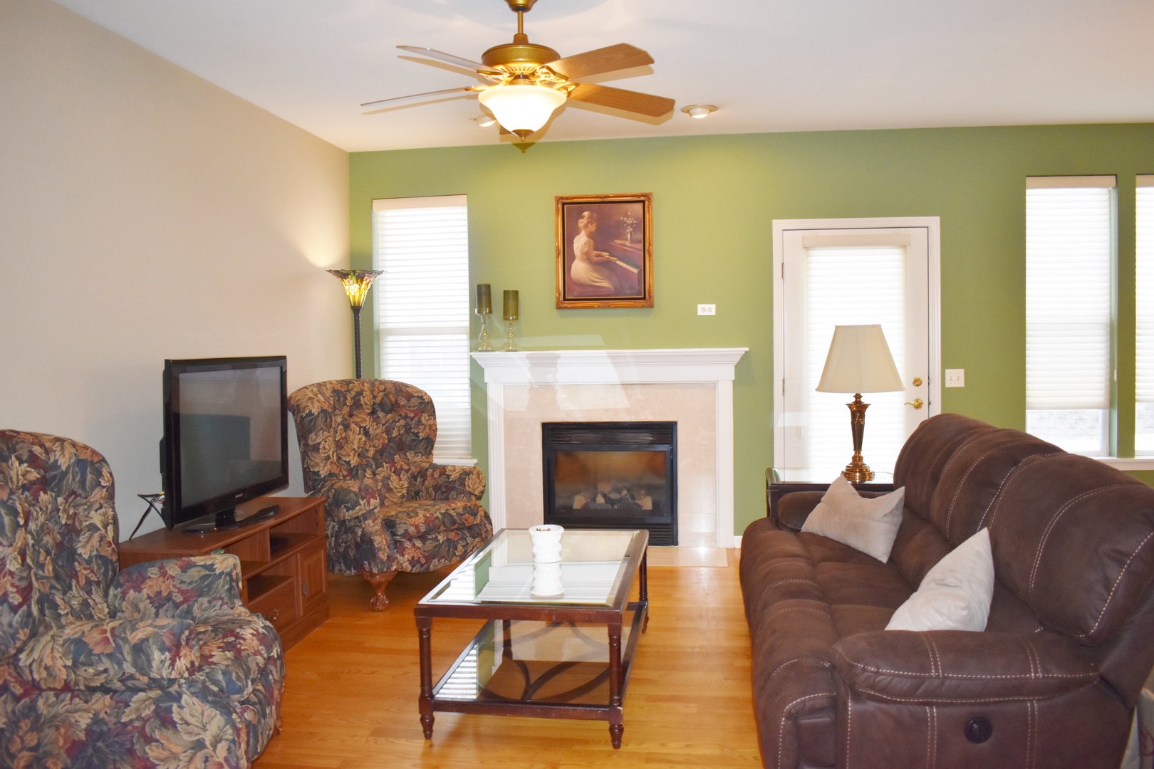 309 Ridge Road North Aurora, IL 60542 - Photo 3 of 16 a living room with furniture and a fireplace