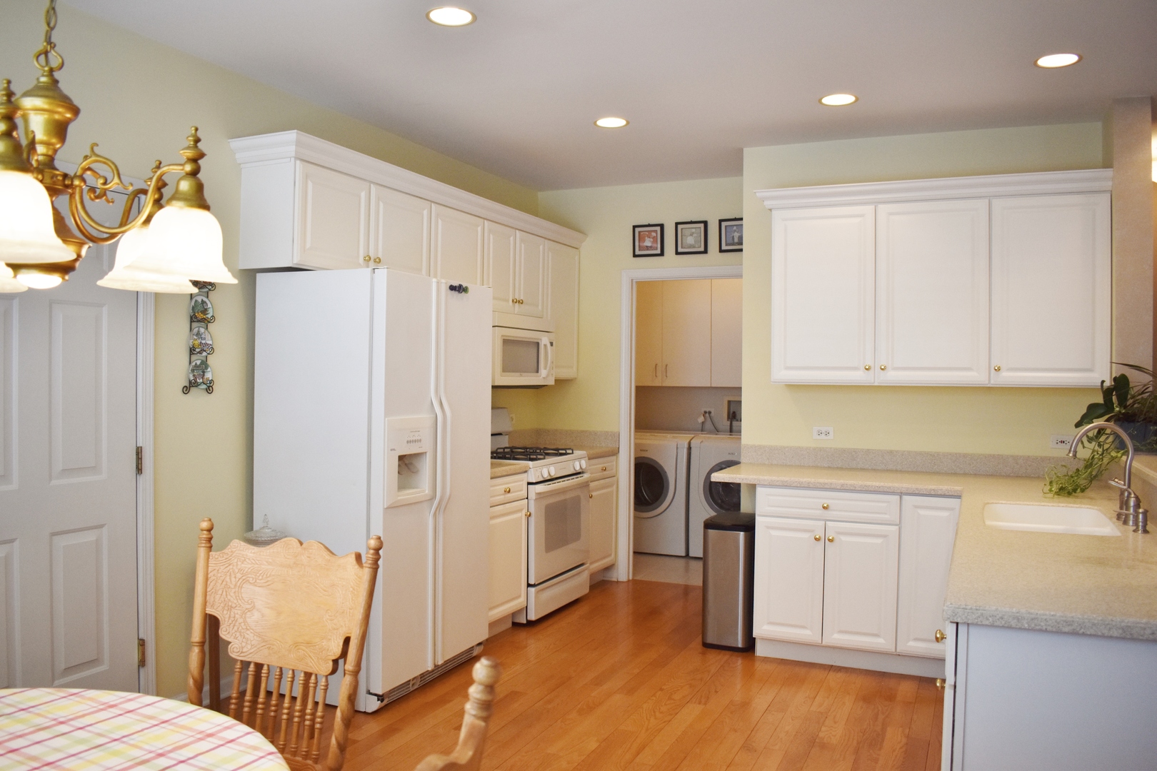 309 Ridge Road North Aurora, IL 60542 - Photo 8 of 16 a kitchen with white cabinets and stainless steel appliances