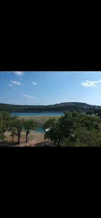 a view of a of water with a yard