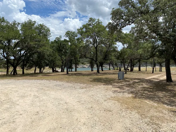 a view of lake with green field