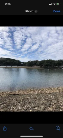 a view of lake with green space