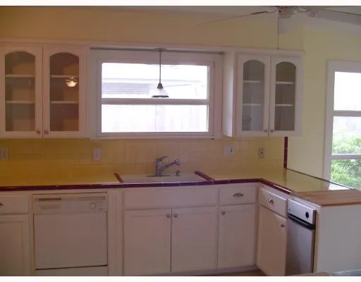 a view of livingroom with hardwood floor and kitchen view