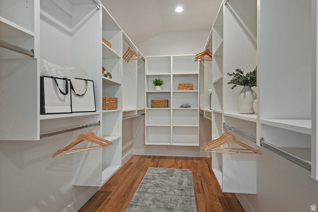 16 Gatehouse Lane Sandy, UT 84092 - Photo 30 of 73 Huge primary walk in closet with light wood finished floors and vaulted ceiling