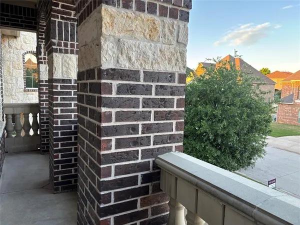a view of balcony with a potted plant