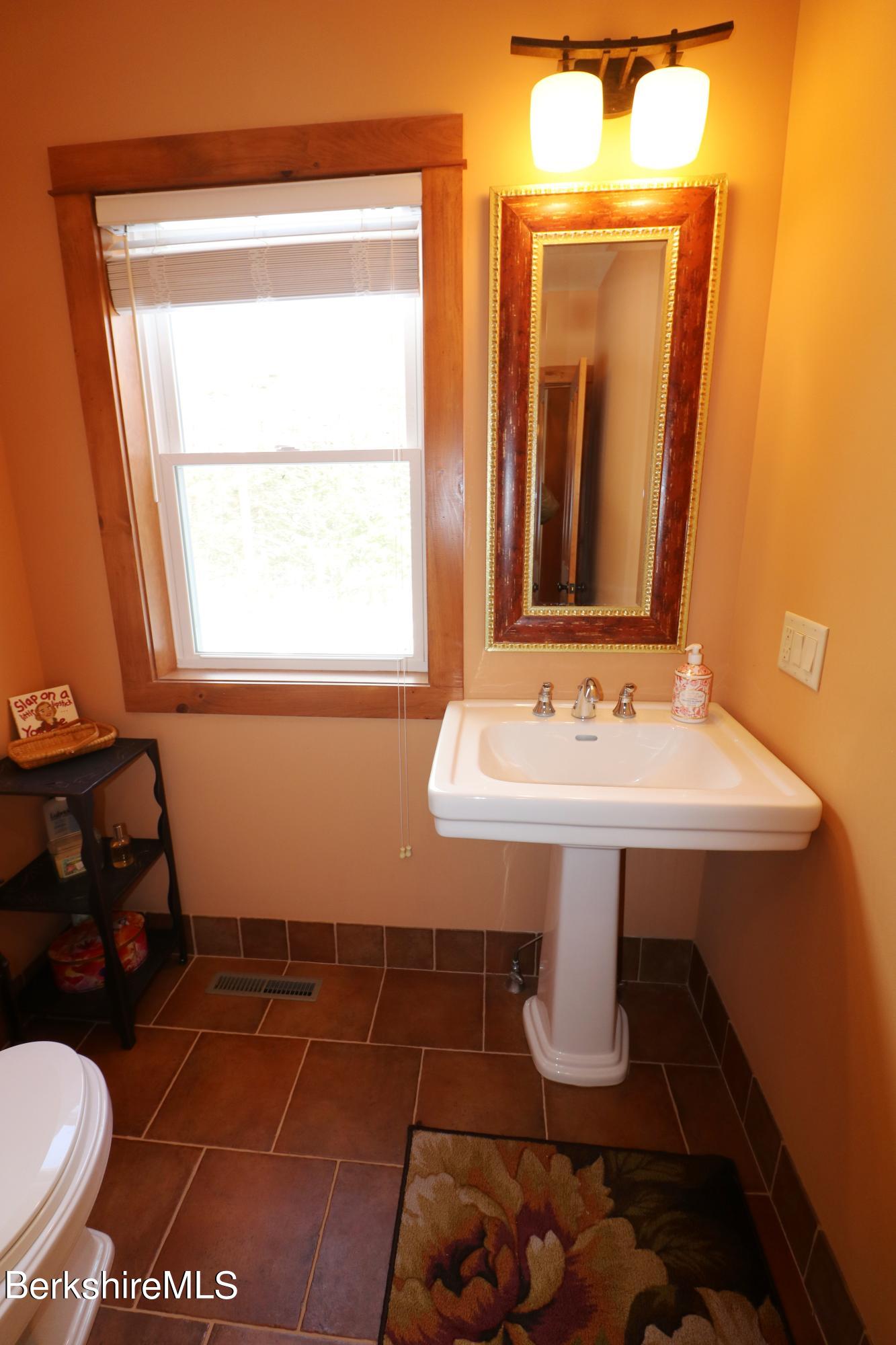 453 Ed Jones Road Otis, MA 01253 - Photo 23 of 41 a bathroom with a sink and a toilet
