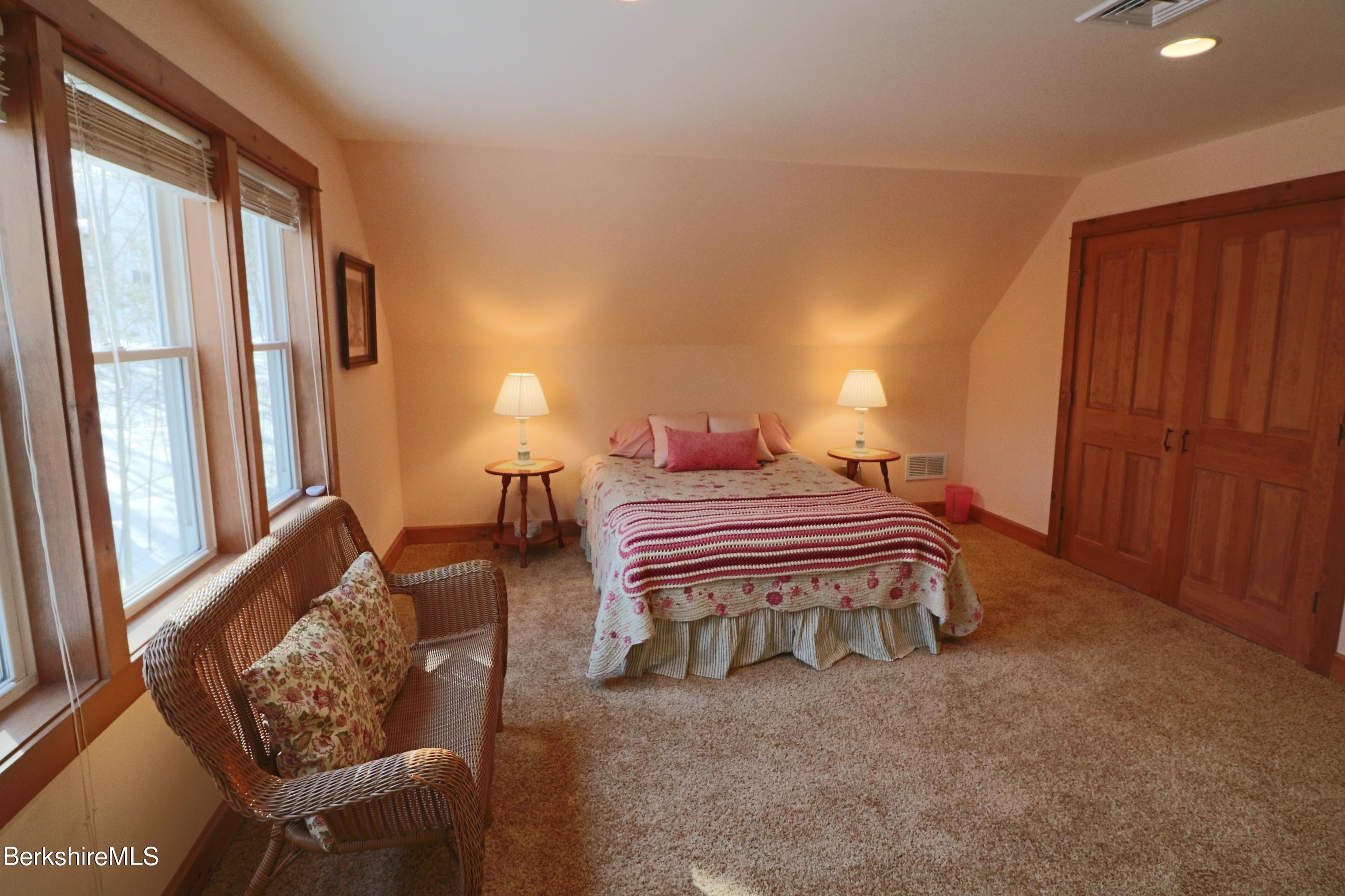 453 Ed Jones Road Otis, MA 01253 - Photo 33 of 41 a bedroom with a bed and a window