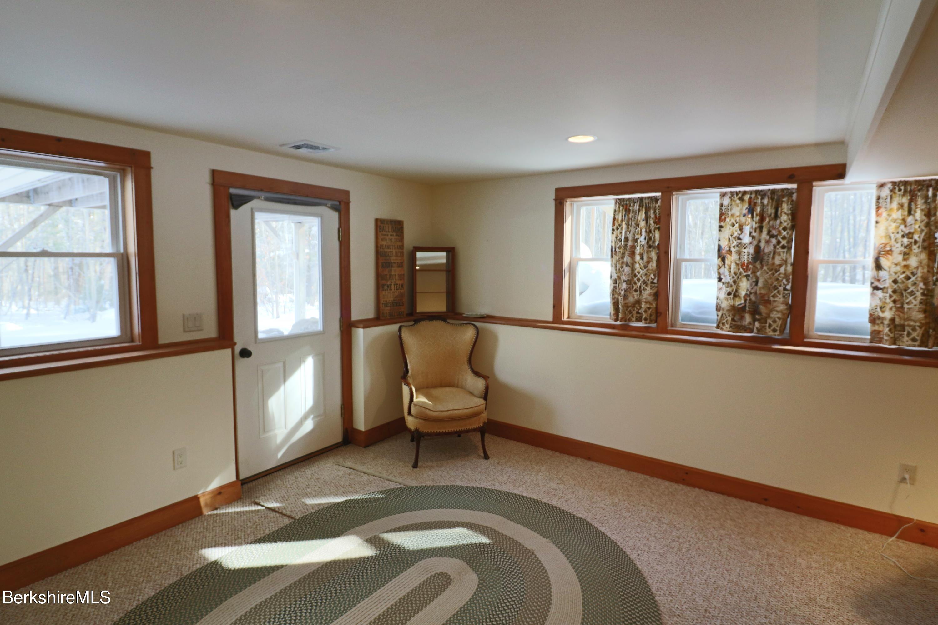 453 Ed Jones Road Otis, MA 01253 - Photo 36 of 41 a living room with furniture and a window