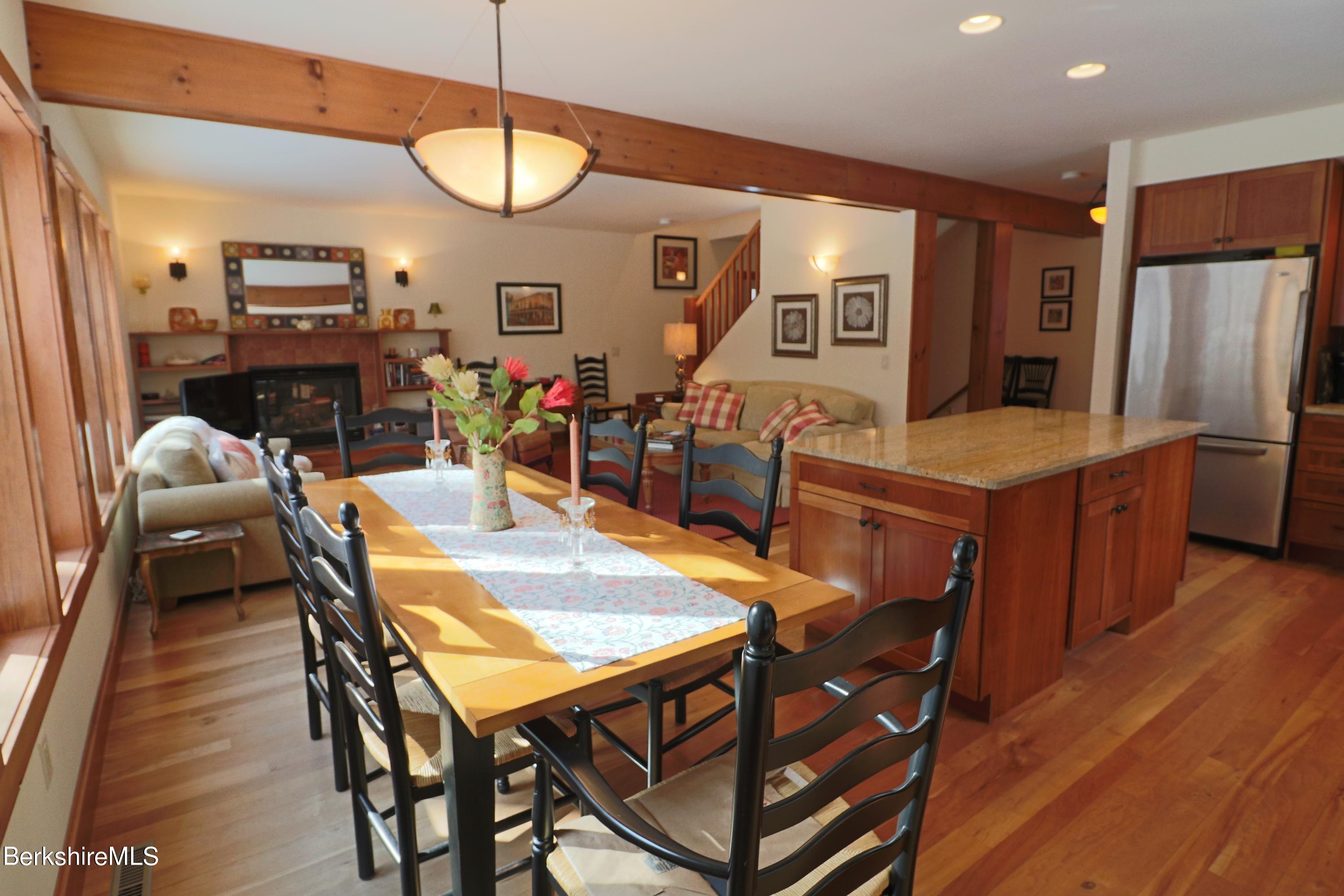 453 Ed Jones Road Otis, MA 01253 - Photo 7 of 41 a view of a dining room with furniture and wooden floor