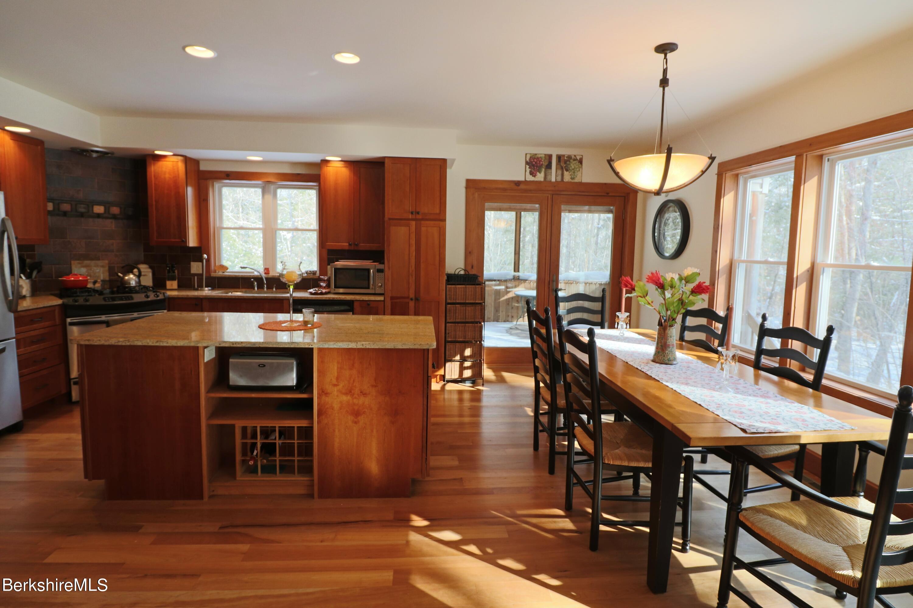 453 Ed Jones Road Otis, MA 01253 - Photo 8 of 41 a view of a dining room with furniture window and wooden floor
