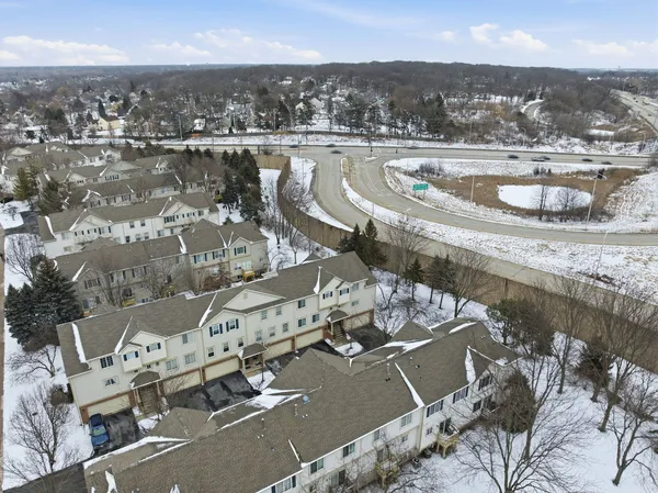 an aerial view of a residential houses with outdoor space