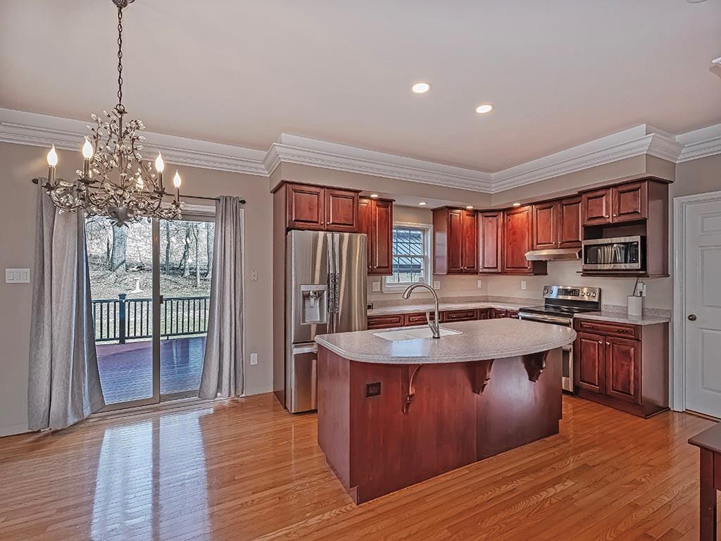 223 Arrowhead Lane Eighty Four, PA 15330 - Photo 13 of 42 a kitchen with stainless steel appliances granite countertop a sink stove and refrigerator