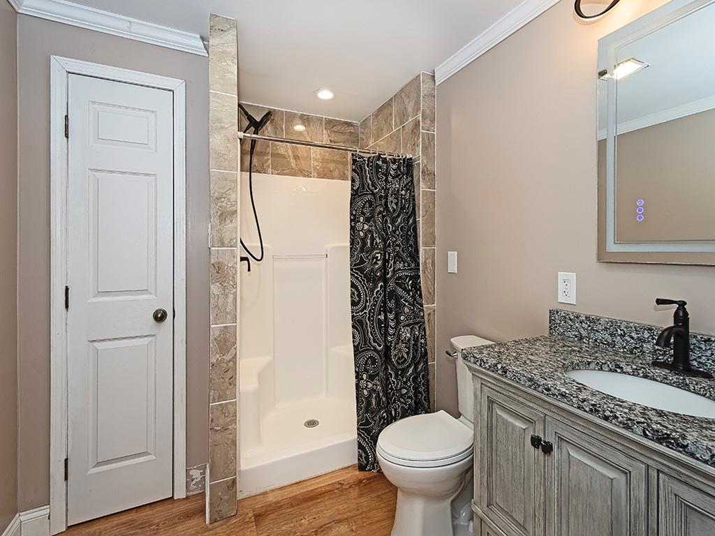 223 Arrowhead Lane Eighty Four, PA 15330 - Photo 36 of 42 a bathroom with a granite countertop toilet sink and shower