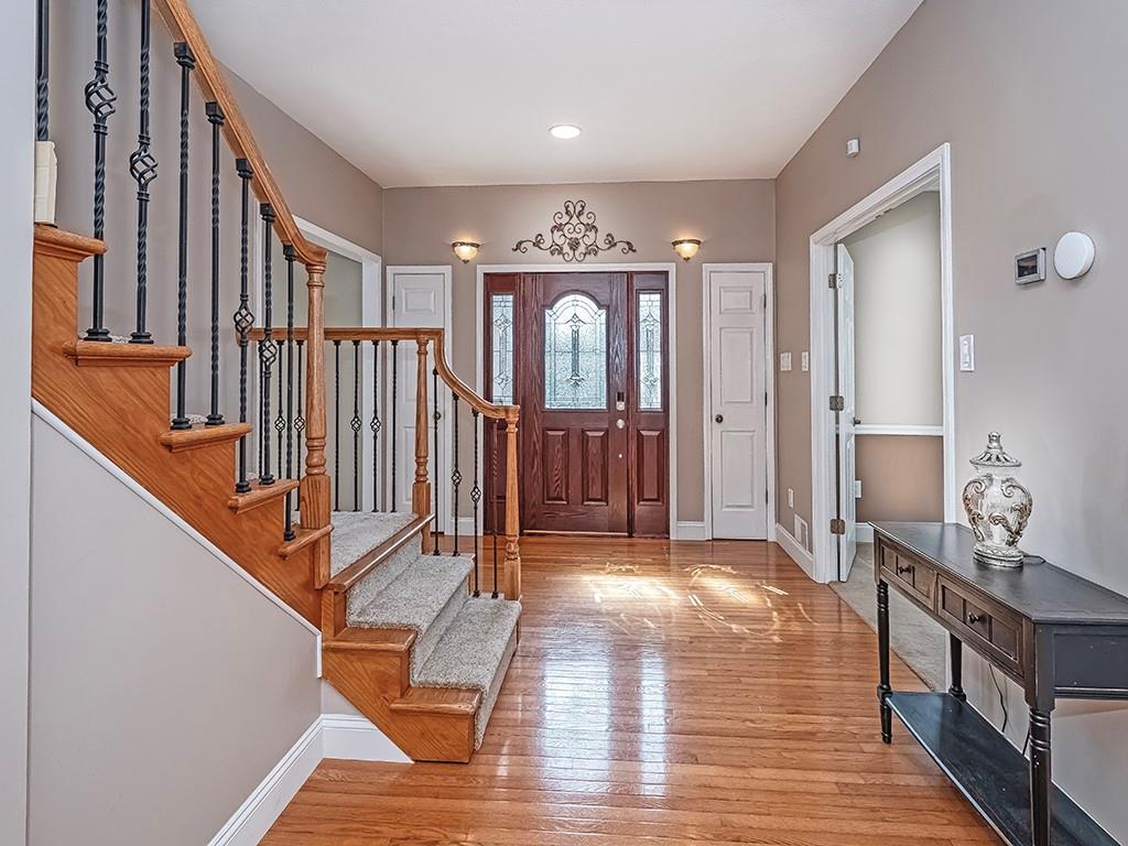 223 Arrowhead Lane Eighty Four, PA 15330 - Photo 5 of 42 a view of a hallway with wooden floor and staircase