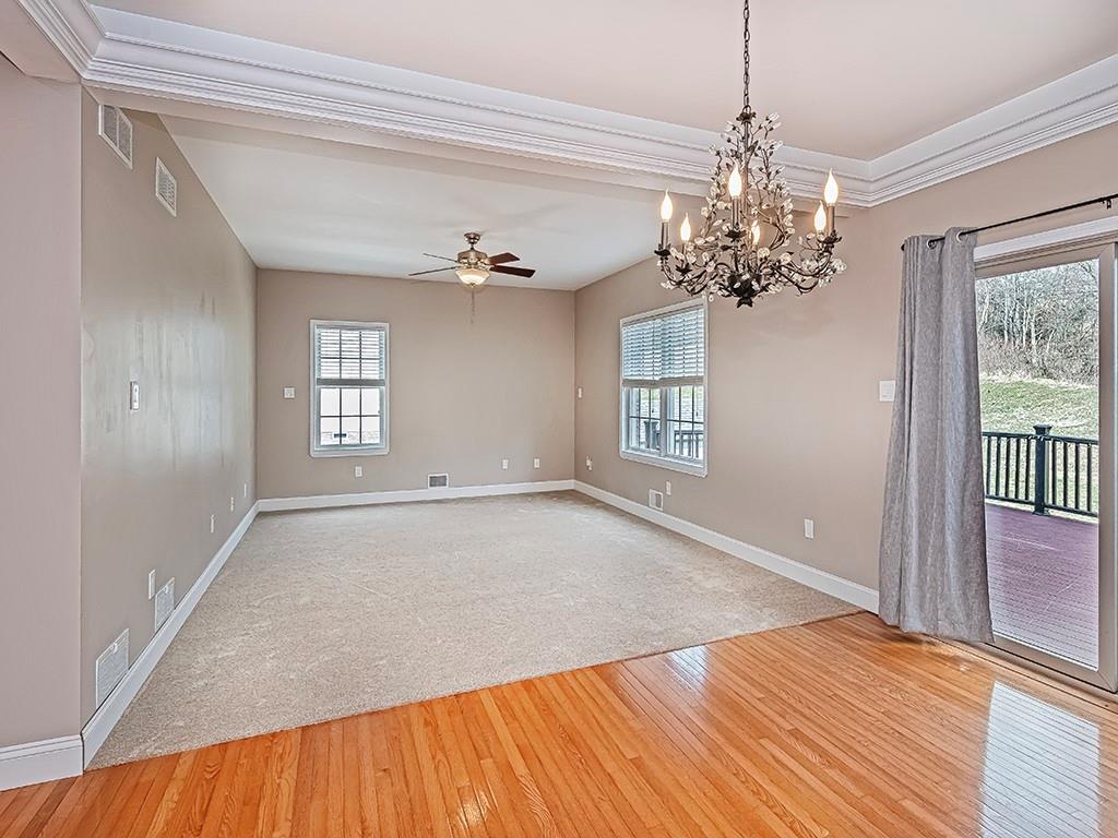 223 Arrowhead Lane Eighty Four, PA 15330 - Photo 9 of 42 a view of empty room with wooden floor and fan