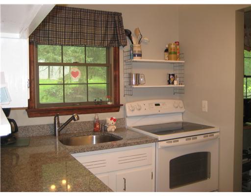 1550 Powers Run Road Pittsburgh, PA 15238 - Photo 5 of 14 Kitchen. Charming, updated white kitchen with newer appliances and view of the back yard.