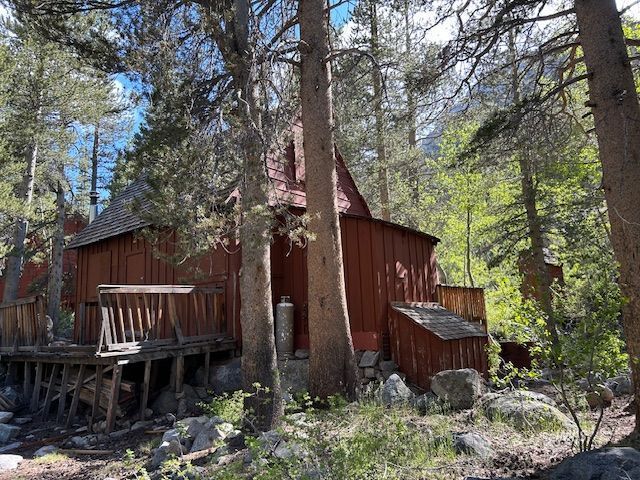 2 South Lake Road Bishop, CA 93514 - Photo 14 of 18 a view of a house with large tree and wooden fence