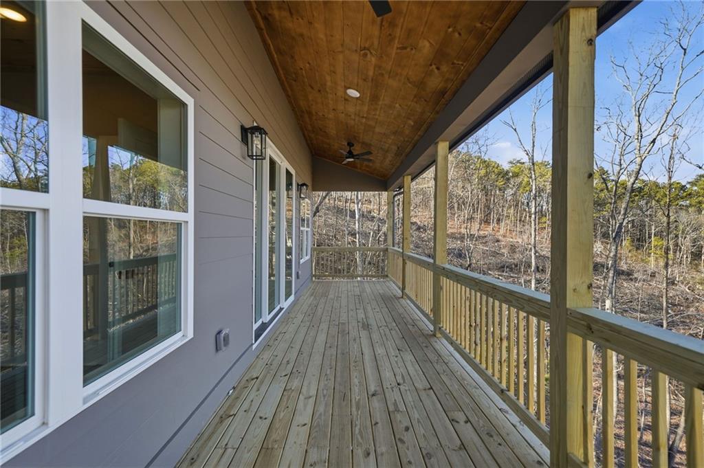 1176 Jewel Court Northeast Ranger, GA 30734 - Photo 31 of 58 a view of a balcony with wooden floor