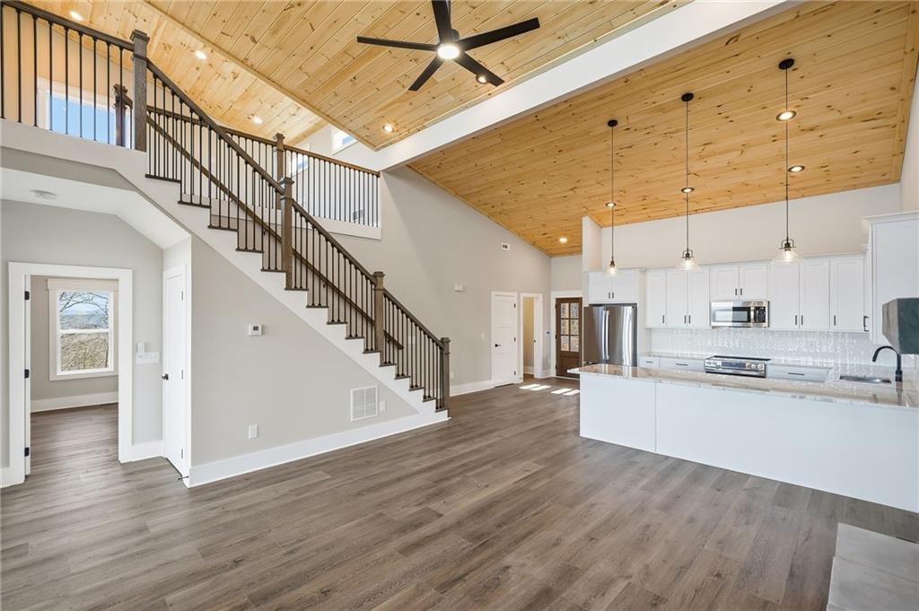 1176 Jewel Court Northeast Ranger, GA 30734 - Photo 7 of 58 a view of a kitchen with wooden floor and electronic appliances