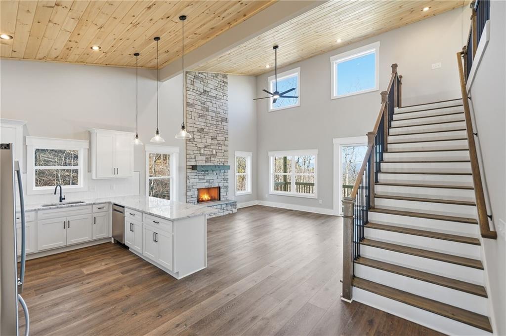1176 Jewel Court Northeast Ranger, GA 30734 - Photo 8 of 58 a kitchen with cabinets and wooden floor