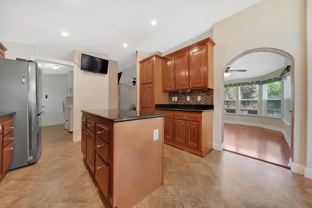 a living room with furniture fireplace and flat screen tv