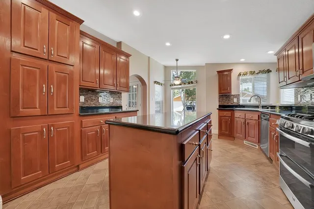 a view of a livingroom with a ceiling fan and window