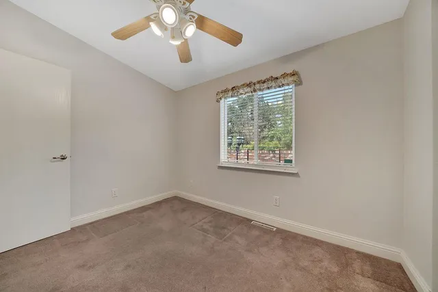 a front view of a house with a yard and a garage