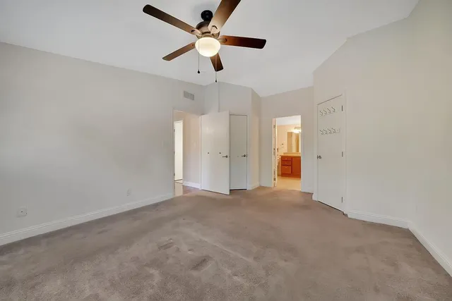 an aerial view of multiple houses with a yard