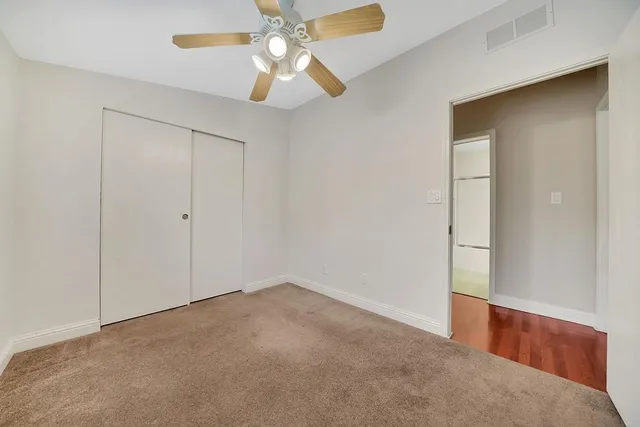 an aerial view of a house with garden space and ocean view