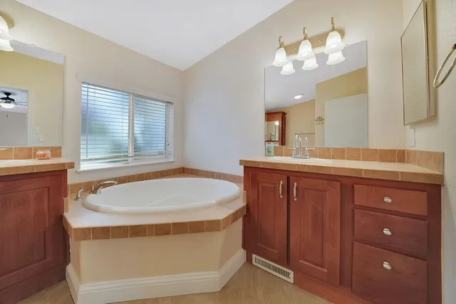 an aerial view of a house with a swimming pool