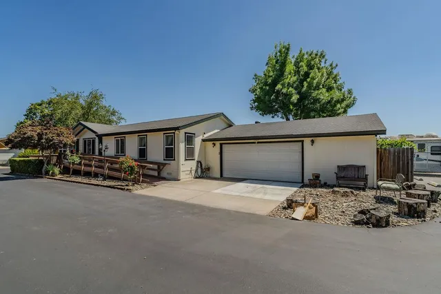 an aerial view of a house with yard fireplace and outdoor seating