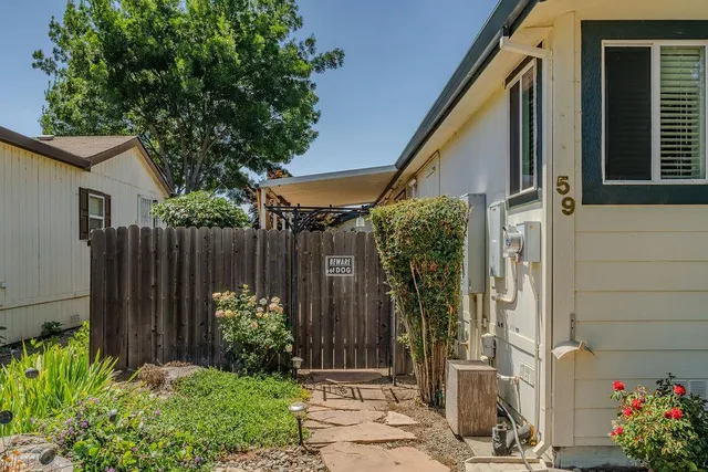 an aerial view of houses with yard