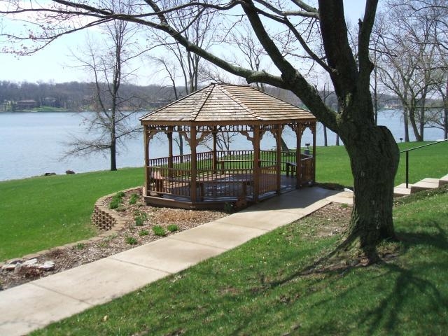 2311 Lake Summerset Road Lake Summerset, IL 61019 - Photo 15 of 23 a view of a yard with a table under an umbrella