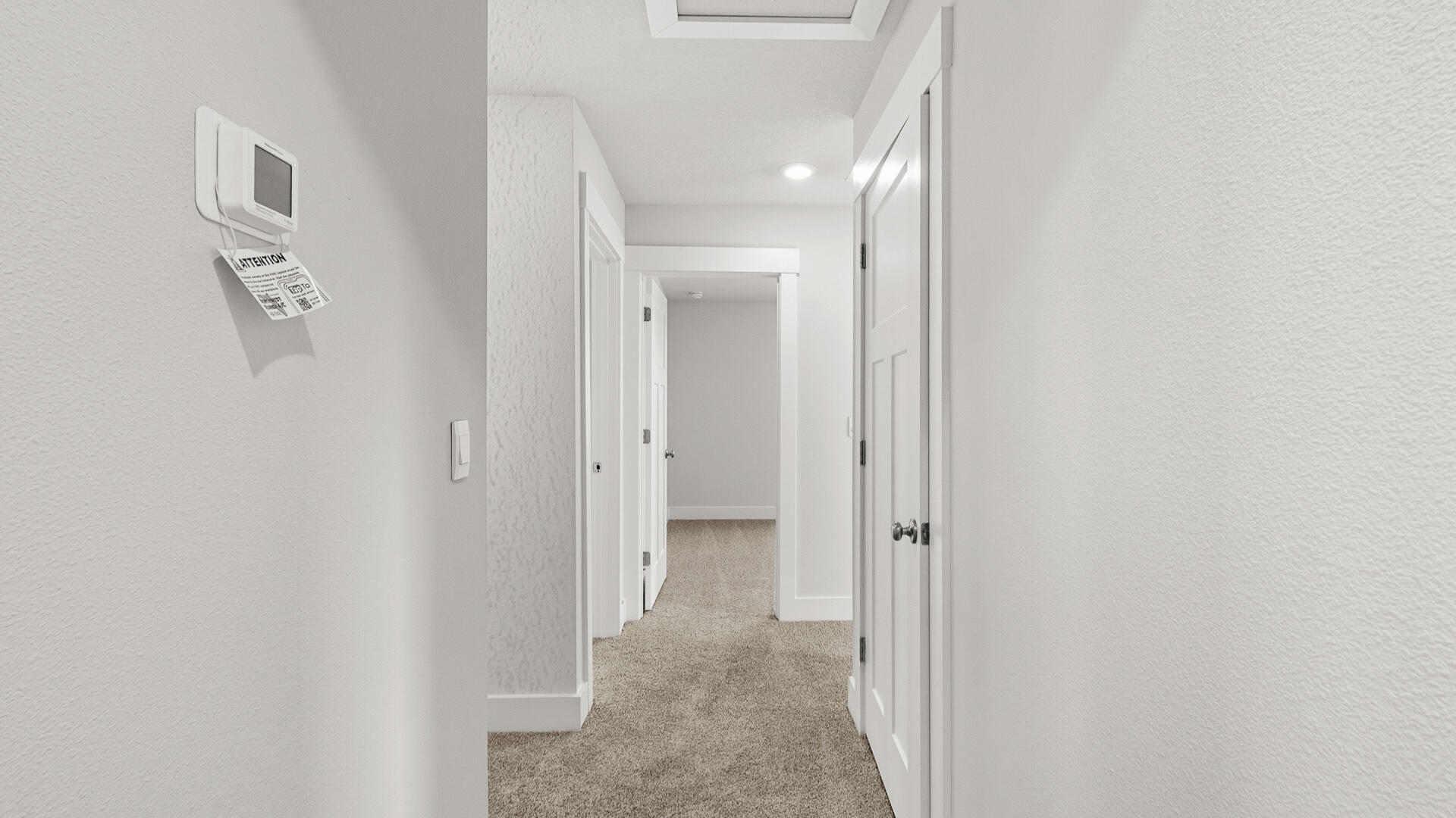 4680 Marine Loop Crestview, FL 32539 - Photo 27 of 34 a view of a hallway with paintings on the wall