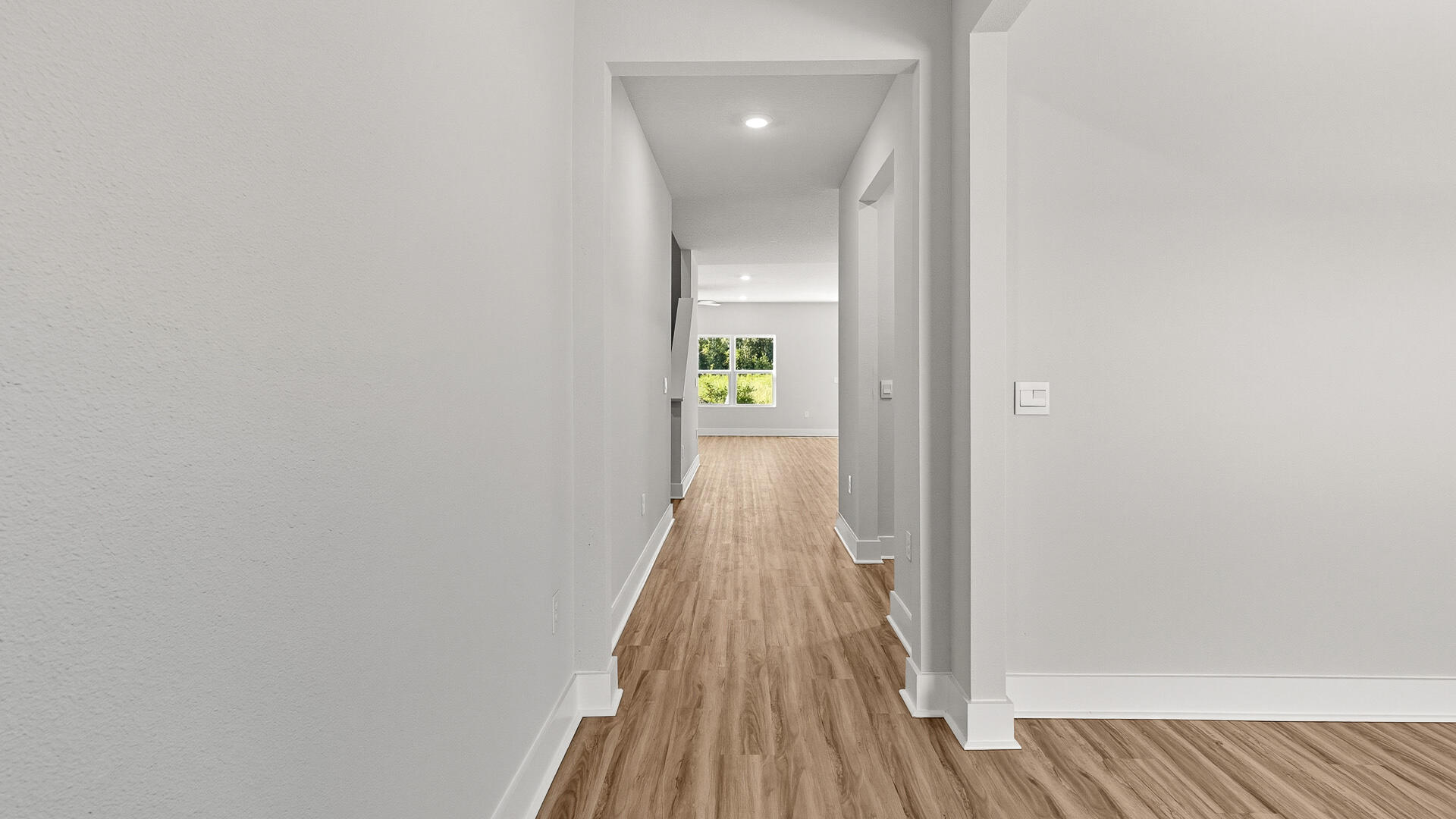 4680 Marine Loop Crestview, FL 32539 - Photo 9 of 34 a view of a hallway with wooden floor