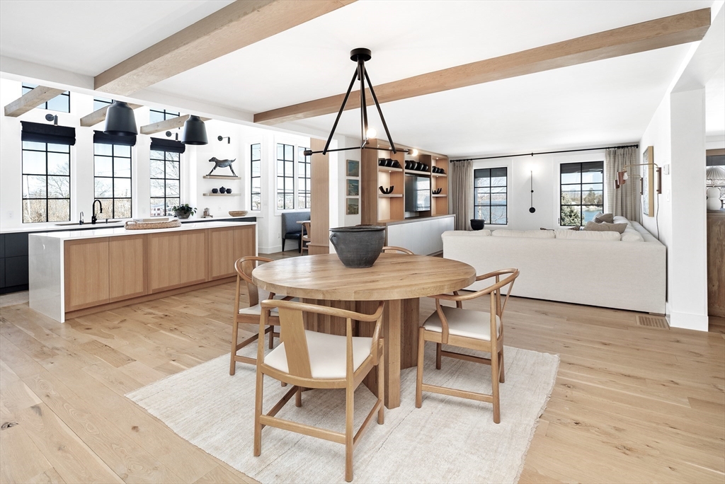 178 Otis Street Hingham, MA 02043 - Photo 14 of 41 a dining room with a wooden table and chairs